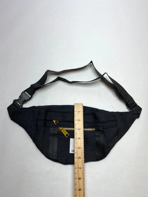 Black with gold-tone zippers and Carhartt logo patch